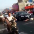 Cina, donna finge di essere stata investita3