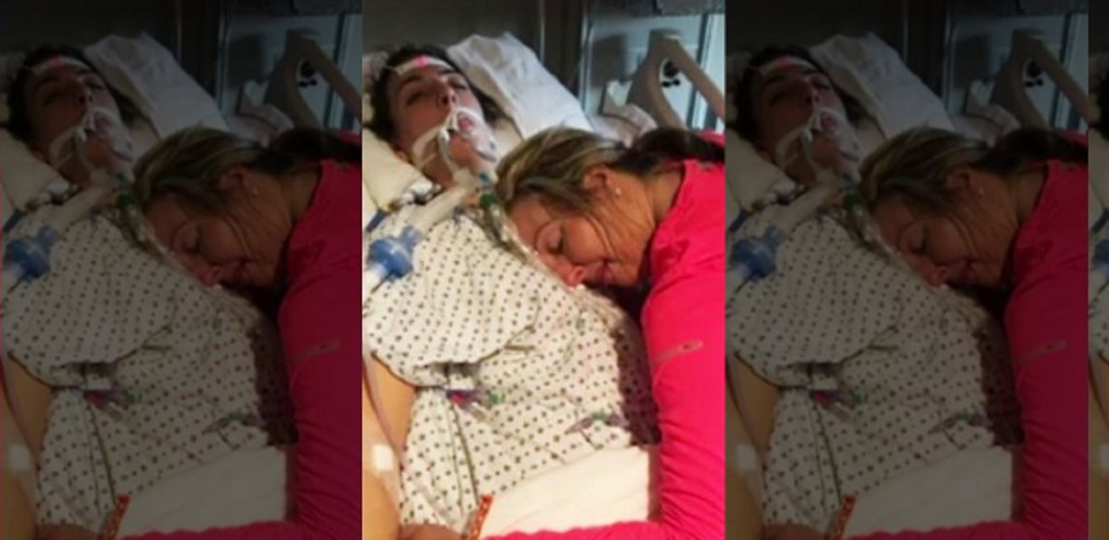 Abbraccia per l'ultima volta la figlia che sta morendo per un'overdose di eroina