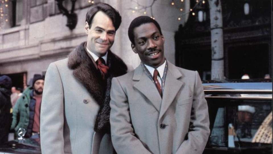 Una poltrona per due, curiosità sulla commedia con Eddie Murphy e Dan Aykroyd: dal film immaginario all'Eddie Murphy Rule, e i protagonisti...